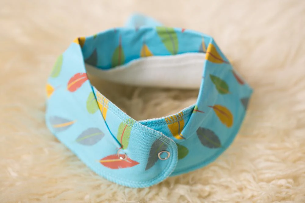 Turquoise feathers organic Cotton DribbleBoo bandana bib - Image 3